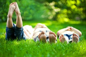kids-lounging-in-grass