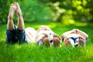 kids-lounging-in-grass