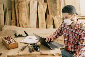 Handyman business owner working on laptop